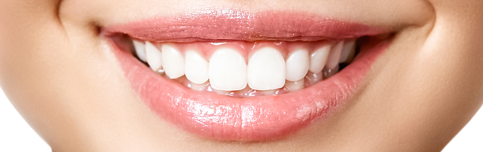 The image shows a close-up of a person s smiling face with teeth, featuring pink lipstick and a partial view of the nose.